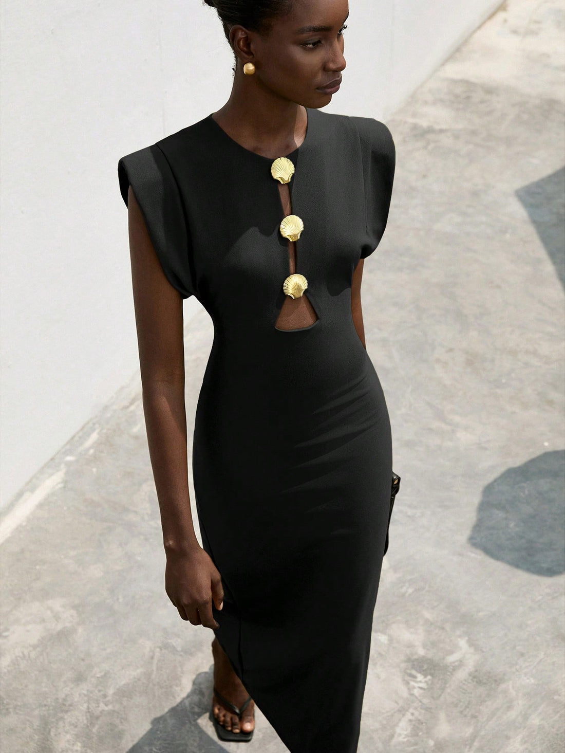 Step into the spotlight with this playful dress featuring bold, exaggerated shoulders and a shiny metallic buckle that adds a touch of sparkle. The cinched waist flatters your figure, creating a fun and flirty silhouette perfect for turning heads at any event. Embrace your confident, stylish side with this standout piece!