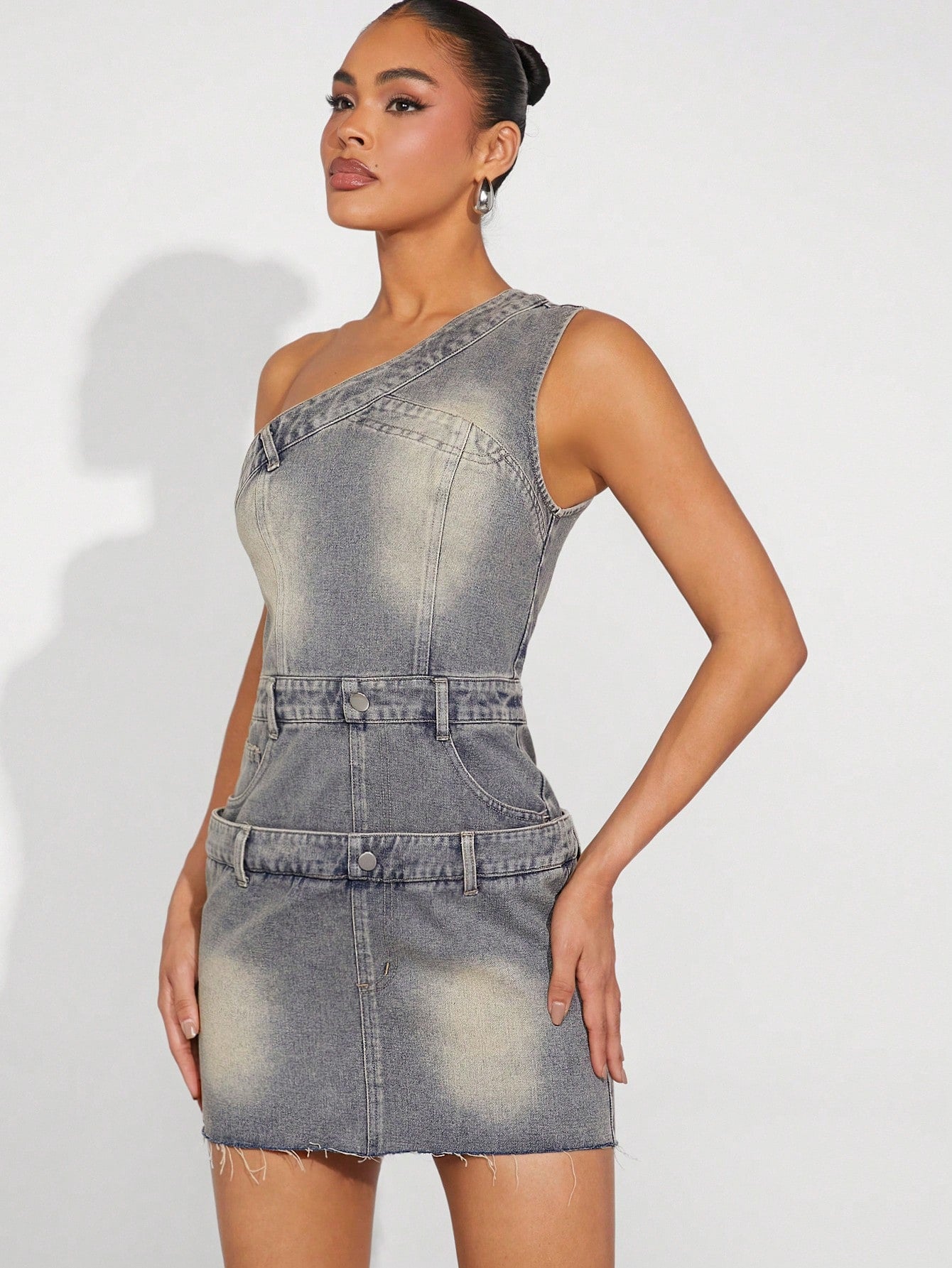 Effortlessly exude confidence and style with our Women's Fashion: Sexy Vintage Asymmetrical Denim Dress. The cinched waist enhances your curves while the asymmetrical hem adds a touch of sophistication. Made with high quality denim, this dress is perfect for any occasion. Show off your fashion sense with this must-have piece.