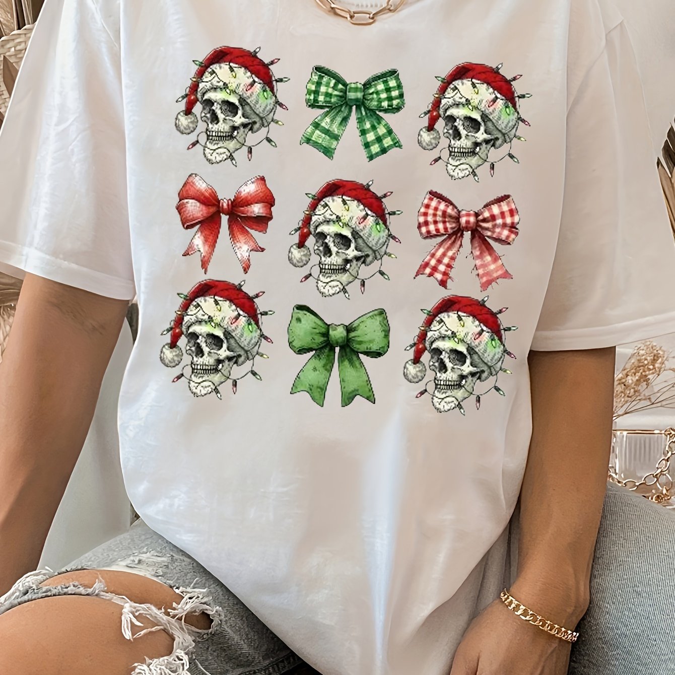 Elevate your festive style with our Women's Festive Christmas Skull T-shirt. Made with premium fabric, this shirt features a unique skull design that captures the holiday spirit. The perfect combination of style and comfort, it's a must-have for any holiday celebration. Embrace the holiday season in style with this festive t-shirt.