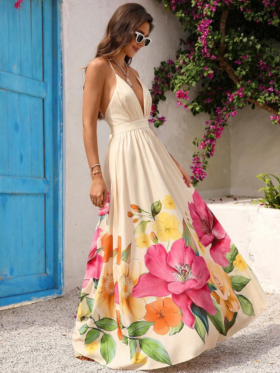 Elevate your summer wardrobe with this stunning floral print maxi dress. Featuring a deep V-neckline, backless design, and criss-cross detailing, it's the perfect choice for beach getaways and special celebrations. The high-waisted silhouette with ruched bust and flared hem creates a flattering, bohemian-inspired look. Crafted from a comfortable woven fabric blend of 95% polyester and 5% elastane, this sleeveless A-line dress offers effortless elegance for any warm-weather occasion. Machine washable for eas