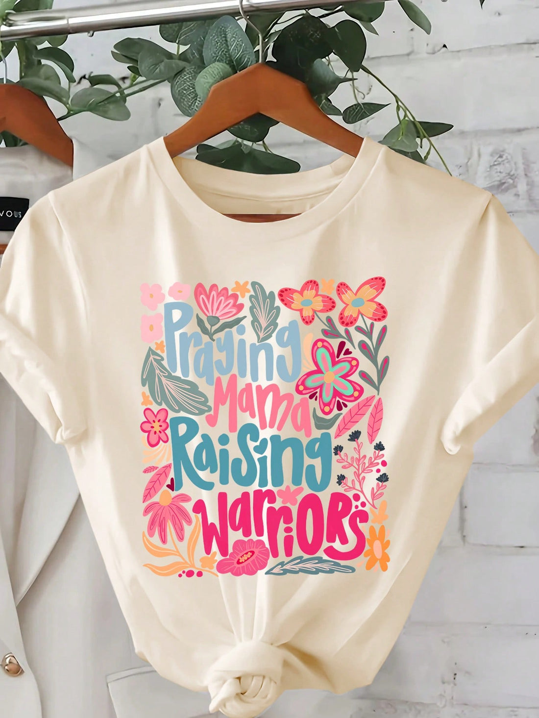 Express your unique sense of style with this women's floral print t-shirt featuring an inspiring slogan. Made with a comfortable round neck and short sleeves, this tee is perfect for showcasing your personality. Stand out from the crowd and spread positivity with this one-of-a-kind top!