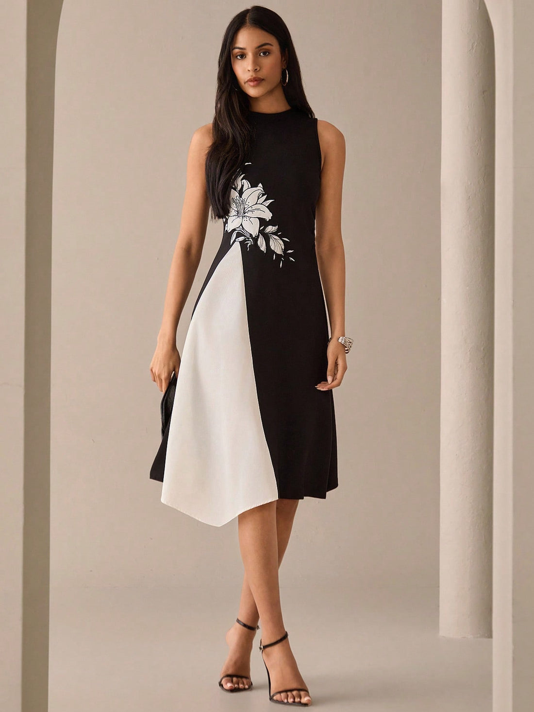 Step into summer with this playful floral print sleeveless midi dress. Featuring a stylish round neck, it’s perfect for sunny days and warm evenings. The breezy design keeps you comfortable while the vibrant floral pattern adds a fun, fresh touch to your wardrobe. Ideal for casual outings or garden parties, this dress brings effortless charm to your summer style.