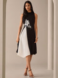 Step into summer with this playful floral print sleeveless midi dress. Featuring a stylish round neck, it’s perfect for sunny days and warm evenings. The breezy design keeps you comfortable while the vibrant floral pattern adds a fun, fresh touch to your wardrobe. Ideal for casual outings or garden parties, this dress brings effortless charm to your summer style.
