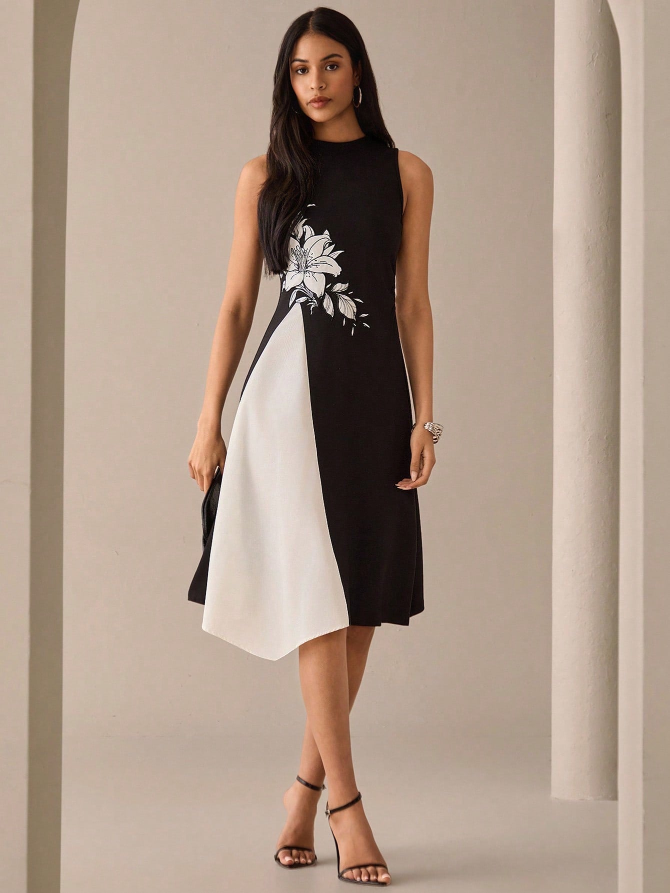 Step into summer with this playful floral print sleeveless midi dress. Featuring a stylish round neck, it’s perfect for sunny days and warm evenings. The breezy design keeps you comfortable while the vibrant floral pattern adds a fun, fresh touch to your wardrobe. Ideal for casual outings or garden parties, this dress brings effortless charm to your summer style.