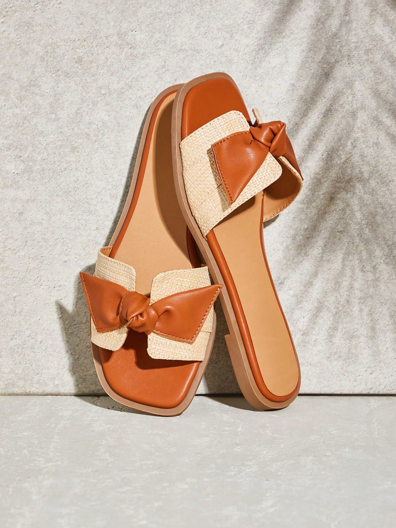 Step into style with these Women's Gold Metallic Bow Flat Sandals! Effortlessly chic and perfect for casual beach days, these stylish slides will add a touch of glamour to any outfit. With their comfortable flat design and playful bow detail, you'll want to wear them all summer long.
