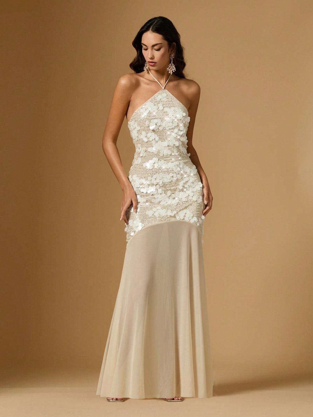 Slip into pure sparkle with this show-stopping halter neck sequin dress! Designed to turn heads at cocktail parties, weddings, or any night out that calls for a little extra glam, this stunner features shimmering sequins that catch the light with every move. The flattering halter neckline offers elegant support while keeping things fun and flirty. Perfect for anyone ready to shine brighter than the disco ball, this dress transforms you into the main event. Whether you're celebrating a special occasion or ju
