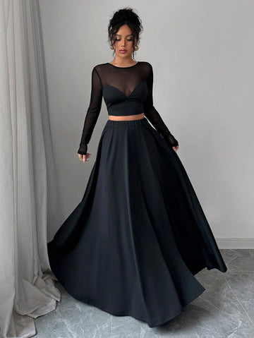 Elevate your wardrobe with this chic mesh patchwork set that effortlessly transitions from festival vibes to everyday chic. The lightweight t-shirt pairs perfectly with the flowing long skirt, creating a minimalist silhouette that flatters every frame. Whether you're jet-setting on vacation, dancing through a music festival, or simply wanting to look put-together, this versatile duo delivers style without the fuss. Mix, match, or wear together—the possibilities are endless!