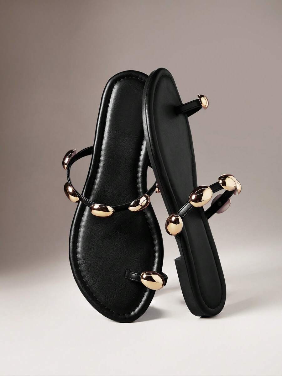 Refresh your warm-weather wardrobe with these Women's Metal Decor Flat Sandals, designed to deliver effortless style and everyday comfort. Featuring a sleek slip-on design with elegant metal accents, these flat sandals offer a modern look that pairs beautifully with dresses, shorts, jeans, skirts, and casual summer outfits.
