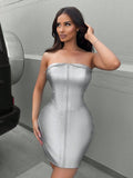 Unleash your bold and daring style with our Women's Metallic Strapless Front Zipper Dress. The chic design features a striking front zipper, adding a touch of elegance to the sleek metallic finish. Perfect for a confident and sophisticated look.