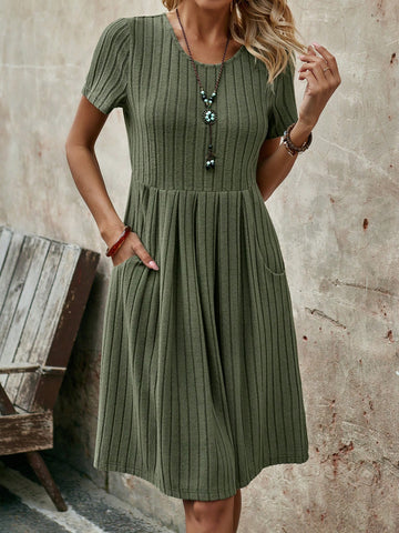 This military green summer dress is perfect for any casual occasion. With its flattering mid-length and comfortable short sleeves, you'll stay cool and stylish all summer long. The round neck adds a touch of elegance to this playful dress. Get ready to turn heads with this unique and eye-catching piece.