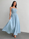 Light blue smocked spaghetti strap maxi sundress with gathered A-line skirt