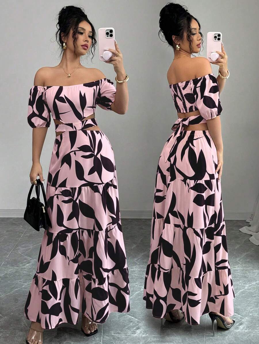 Escape to paradise in this charming off-shoulder dress that's practically begging for a vacation photo. The vibrant floral print brings instant tropical vibes, while the playful tie-up detail and asymmetrical hem add just the right amount of sass. Perfect for beach days, resort dinners, or anywhere you want to feel effortlessly chic and carefree. Slip it on and let the adventure begin!