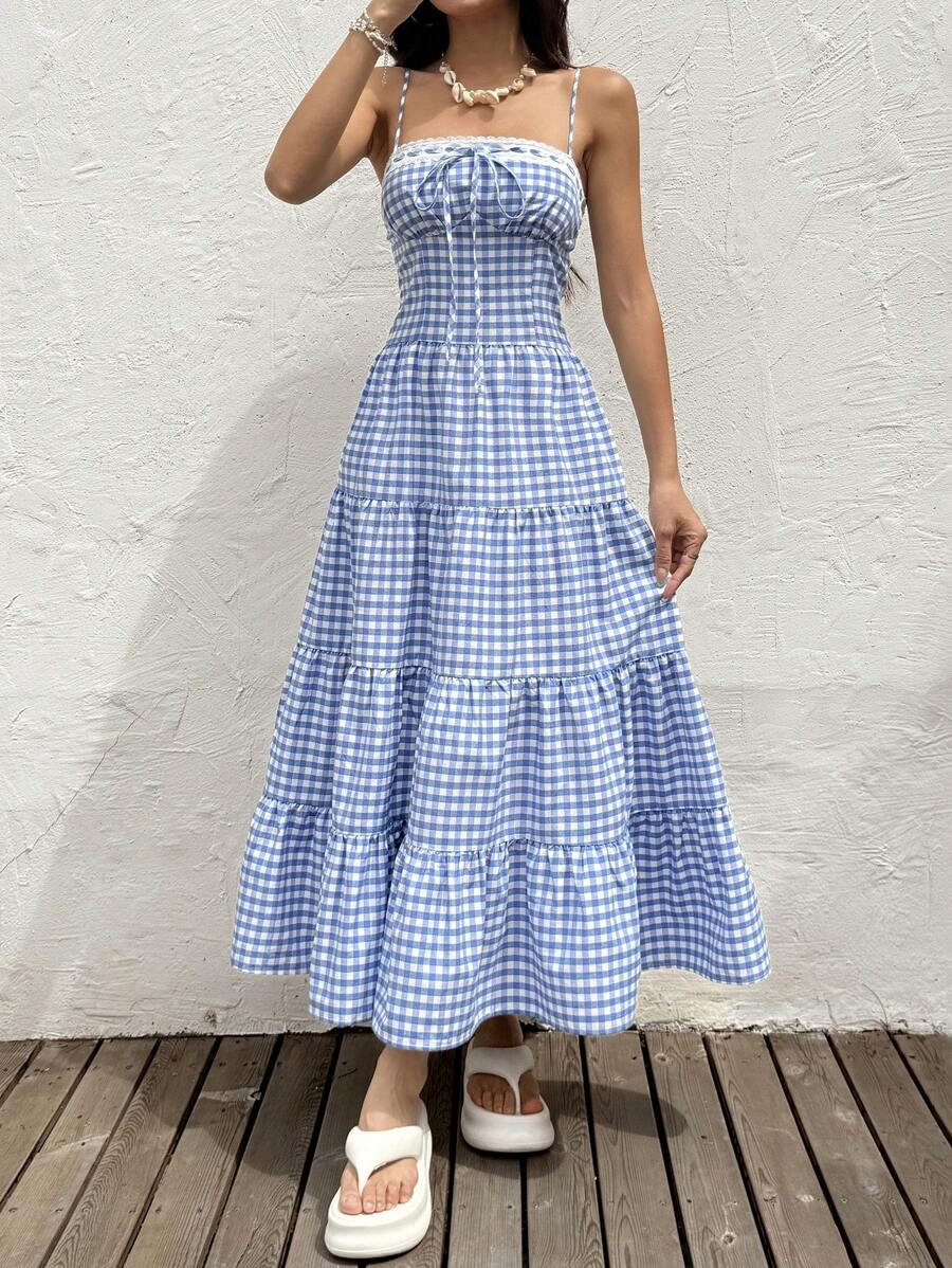 Unleash your inner adventurer with our Women's Plaid Sleeveless Long Dress! Perfect for casual resort wear, this dress will keep you stylish and comfortable during all your summer adventures. So go ahead, pack your bags and hit the road (or beach) with ease!