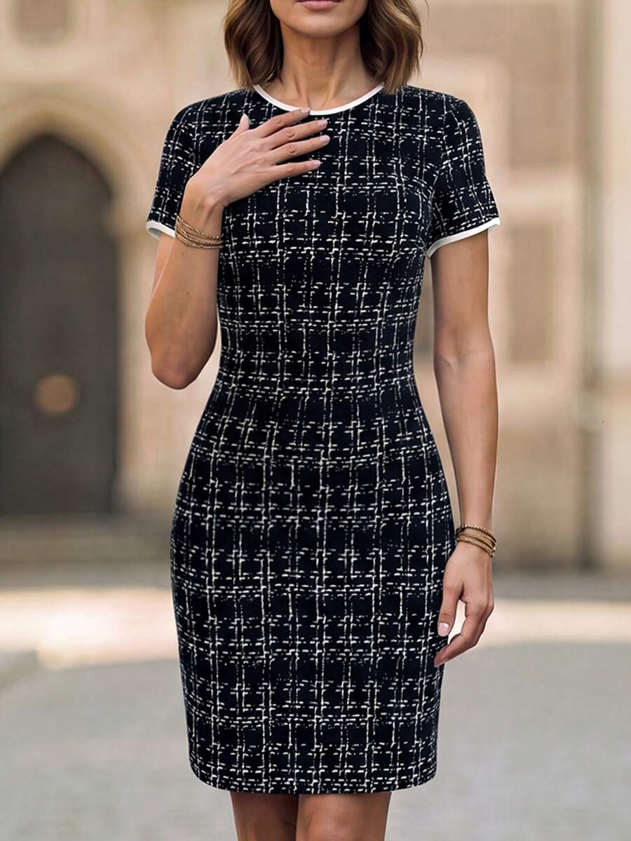 Front view of black and white abstract plaid slim fit mini dress