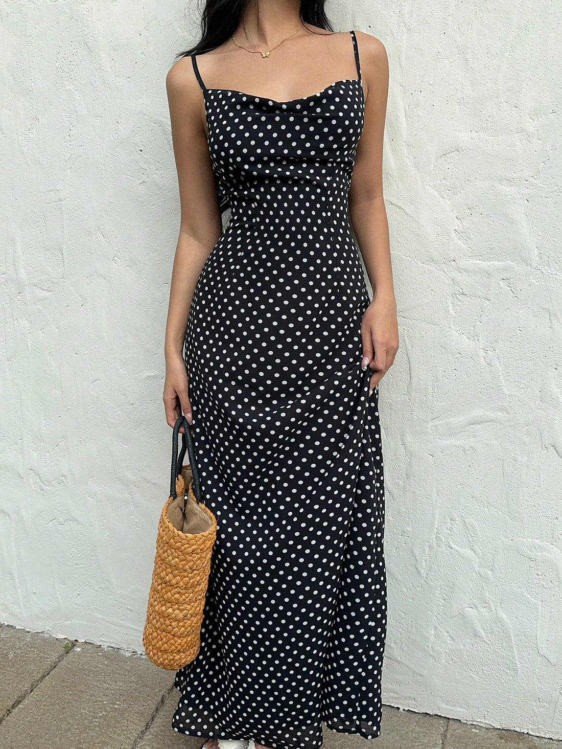 Make a statement in this Vintage Polka Dot Maxi Dress! With its Plunging Neck and Mermaid Style, this dress is sure to turn heads. Its fitted design will hug your curves in all the right places. Perfect for those who want to stand out in style.