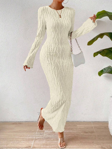 Elevate your evening look with this sophisticated rib-knit bodycon maxi dress. Crafted from a luxurious solid fabric, it hugs your curves beautifully while maintaining an elegant silhouette. The delicate lettuce trim detailing adds a refined touch to the neckline and hem, creating a polished finish perfect for formal events, cocktail parties, or upscale dinners.&nbsp;