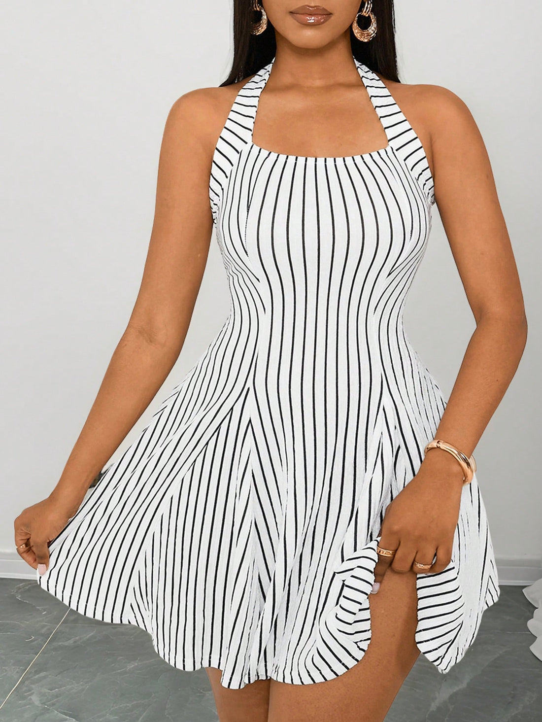 Turn heads with this Women's Sexy Halter Neck Bodycon Dress! The chic winter mini outfit is complete with under shorts for added coverage. Enjoy a daring look while staying warm and fashionable.