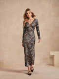 Unleash your wild side in this trendy leopard print dress. With a sexy hollow out design and flattering maxi length, you'll be the life of the party. Perfect for bold fashionistas looking to make a statement. (Meow!)