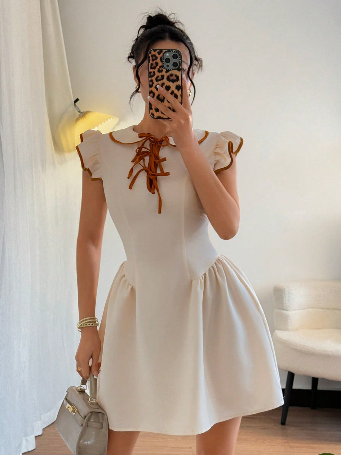 Compliment your chic doll face with this playful short dress! Featuring a ruched waist and cap sleeves, it's the perfect combination of style and comfort. Stand out in a unique and fun way with this dress. Doll up and be the life of the party!