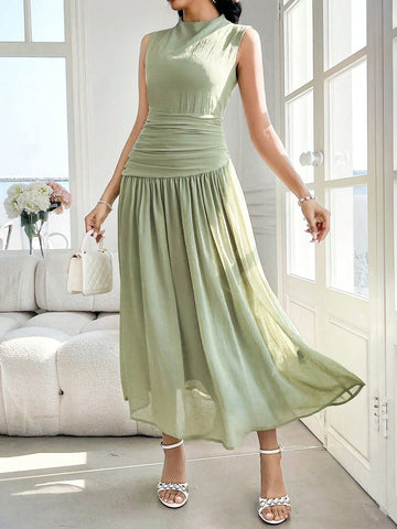 Introducing our Women's Sleeveless High Neck Ruched Midi Dress, a perfect blend of elegance and chic style for any occasion. With its high neck and ruched detailing, this dress will make you stand out in a crowd. Perfect for any event, from weddings to parties, this dress is a must-have for any fashion-forward woman.