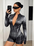 Front view of black and gray web-print long-sleeve zip romper