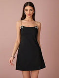 Step into the season with our Women's Spring/Summer Black Mini Suspender Dress! Featuring a cute rhinestone bow and subtle sparkle, this dress will have you turning heads. Plus, the suspenders add a playful twist to this must-have dress. Perfect for any occasion, you'll feel confident and stylish all day long!
