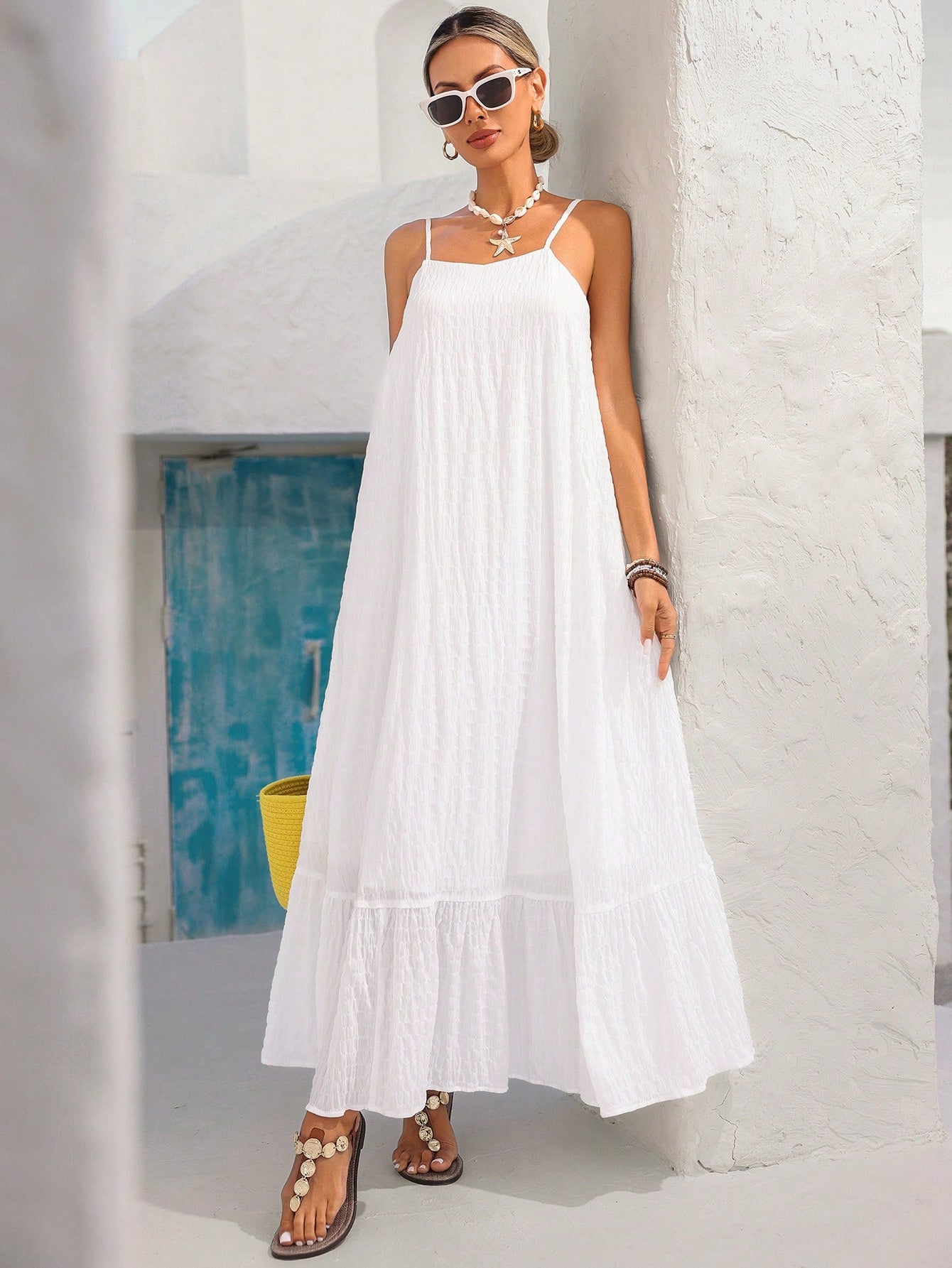 Elevate your warm-weather wardrobe with this sophisticated dress, designed for those who appreciate refined simplicity. The striking backless silhouette creates an alluring focal point, while delicate ruffles add movement and dimension. Crafted from textured fabric that drapes beautifully, this piece transitions seamlessly from daytime outings to evening occasions. The thoughtful construction ensures comfort without compromising on style, making it an essential addition for spring and summer seasons. Perfec