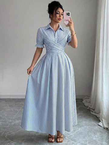 Full front view of blue and white striped collared shirt dress with puff sleeves and tie waist