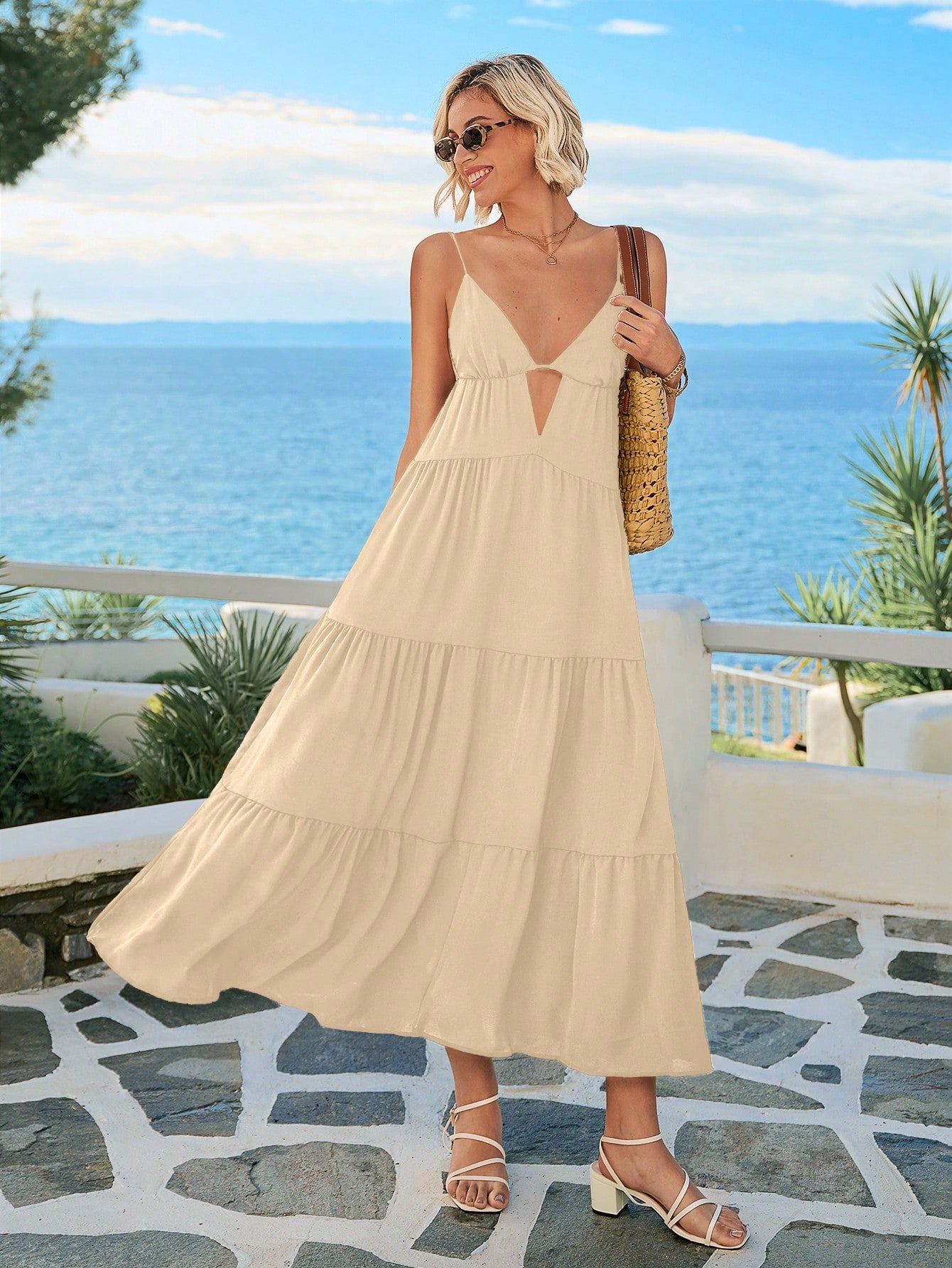 Embrace sunny days in this playful summer maxi dress featuring a breezy cami style, a flirty cut-out front, and a charming ruffle hem. Perfect for beach getaways or lively festivals, it combines comfort and style effortlessly to keep you cool and radiant wherever you go.