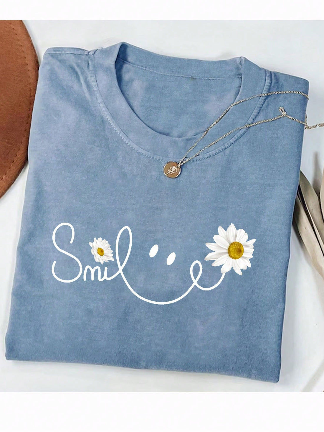 Get ready to bloom this summer in our playful Women's Summer Casual Daisy Floral Graphic T-Shirt! Featuring a fun letter print and daisy floral graphic, this short sleeve top is both cute and comfortable. Perfect for a casual day out or a trip to the beach.