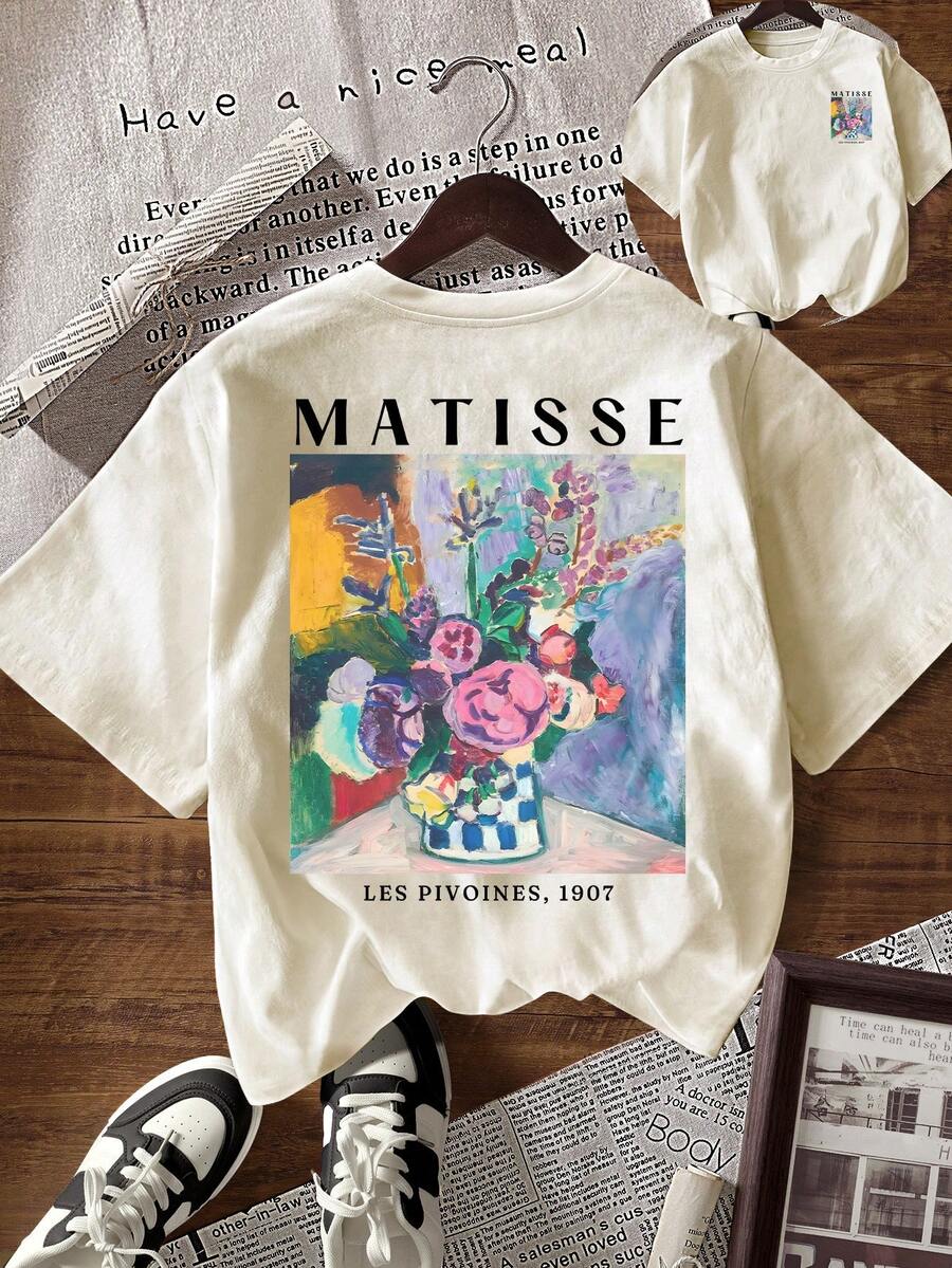 Flat lay of apricot floral art T-shirt showing large Matisse peony print and small chest design