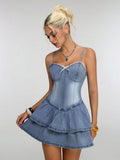 Front three-quarter view of light-wash Y2K corset mini denim dress with lace trim and tiered skirt