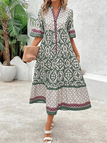 Green geometric print midi dress front view with notched neckline and flounce sleeves