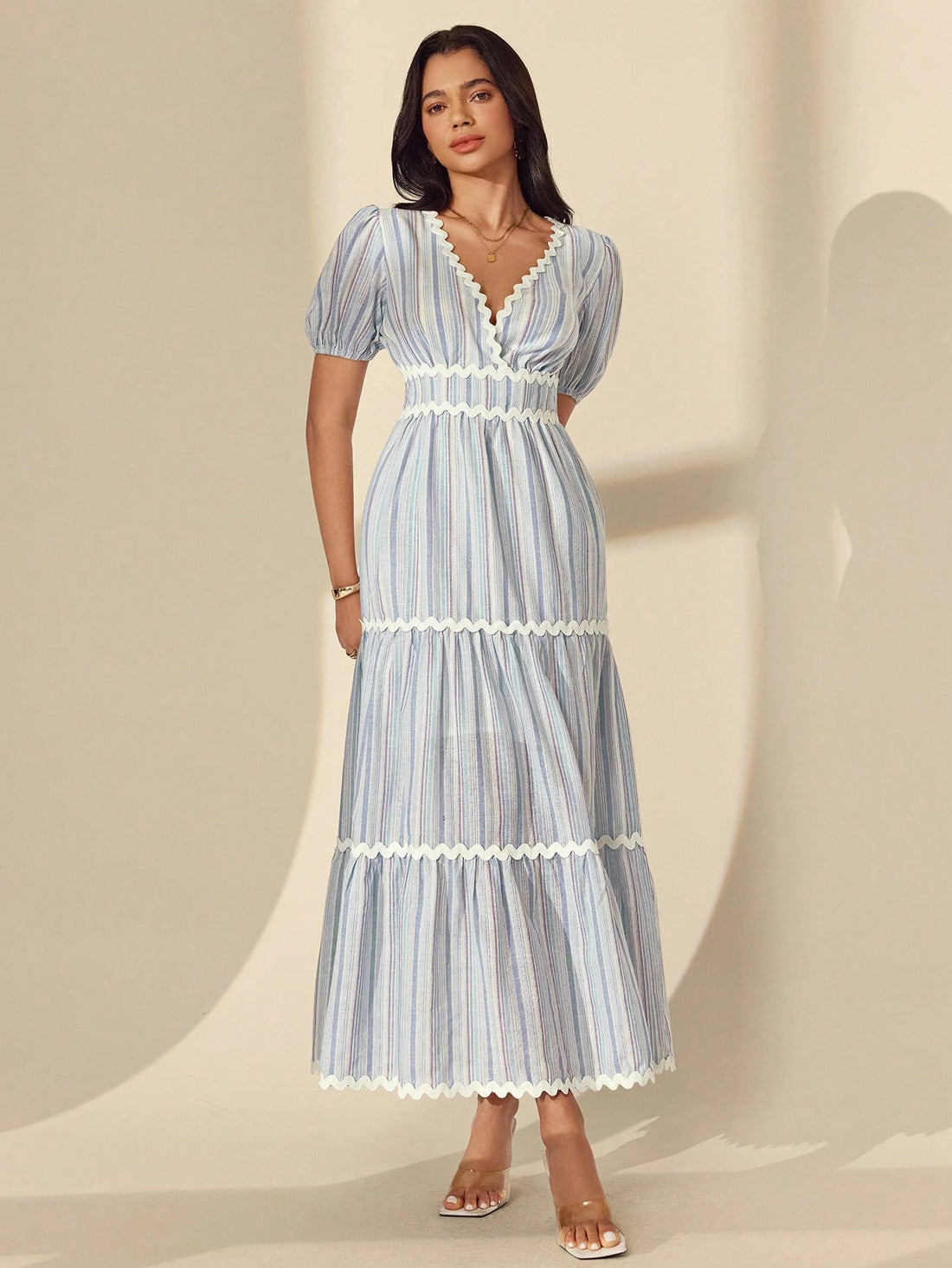 Escape to effortless elegance with this charming striped maxi dress! Featuring a flattering surplice neckline and playful puff sleeves, it's designed to turn heads whether you're strolling beachside or sipping cocktails at sunset. The tie waist cinches your silhouette beautifully while the flowing maxi length keeps you cool and comfortable all day long. Perfect for vacations, garden parties, or any occasion calling for breezy sophistication. This is the dress that makes you feel like you're always on holida