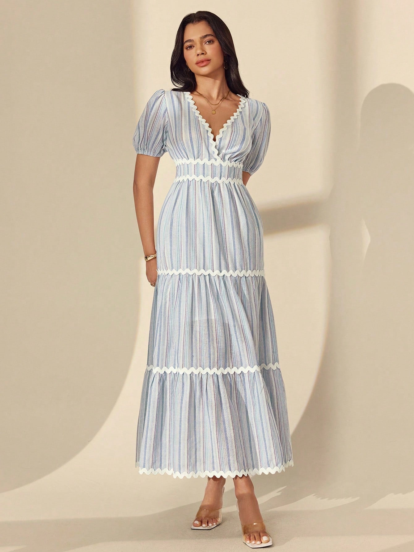 Escape to effortless elegance with this charming striped maxi dress! Featuring a flattering surplice neckline and playful puff sleeves, it's designed to turn heads whether you're strolling beachside or sipping cocktails at sunset. The tie waist cinches your silhouette beautifully while the flowing maxi length keeps you cool and comfortable all day long. Perfect for vacations, garden parties, or any occasion calling for breezy sophistication. This is the dress that makes you feel like you're always on holida
