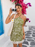 Sway into summer with this flirty halter dress that's practically begging for a beach backdrop! Delicate flower embroidery adds a touch of romance, while playful tassels dance with every step. Perfect for turning heads on cruise decks or making sandy footprints look extra stylish. This vacation-ready number transitions effortlessly from beachside lounging to sunset cocktails – just add sandals and attitude!