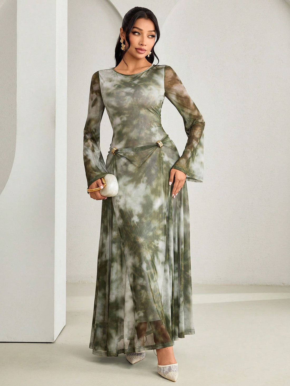 Twirl into vibrant style with this stunning tie dye dress that's equal parts bohemian and bold. Flare sleeves add a dramatic flair while delicate metal accents catch the light with every movement. The mesmerizing tie dye pattern brings artistic energy to your wardrobe, perfect for making a statement at any occasion. Inspired by elegant Arabic fashion, this piece celebrates cultural beauty with modern flair. Comfortable, eye-catching, and undeniably chic—your new favorite dress awaits.