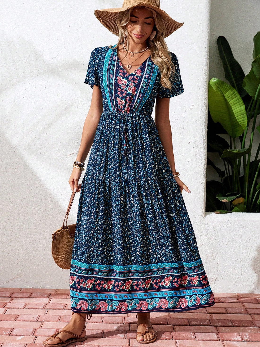 Look effortlessly chic on your next vacation or beach outing with our Women's V-Neck Flutter Sleeve Printed Maxi Dress. The delicate flutter sleeves and vibrant print make it perfect for a day at the beach or a night out. Plus, the flowy design offers comfort and breathability for those warm summer days.