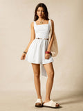 Step into summer fun with this playful white knitted mini dress. Featuring a breezy sleeveless design and a flattering square neckline, it’s perfect for beach days or casual outings. The lightweight knit fabric keeps you cool while adding a touch of texture to your look. Easy to dress up or down, this mini dress brings effortless style and comfort to your warm-weather wardrobe.
