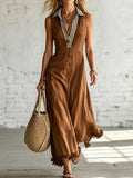 Front view of brown sleeveless maxi shirt dress with striped collar and frayed hem