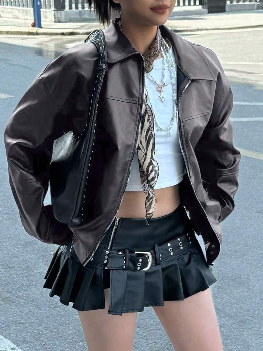 Front three-quarter view of charcoal grey faux leather bomber jacket styled for streetwear