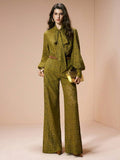 Full front view of olive floral-lace tie-neck blouse and wide-leg pants set styled for formal evenings