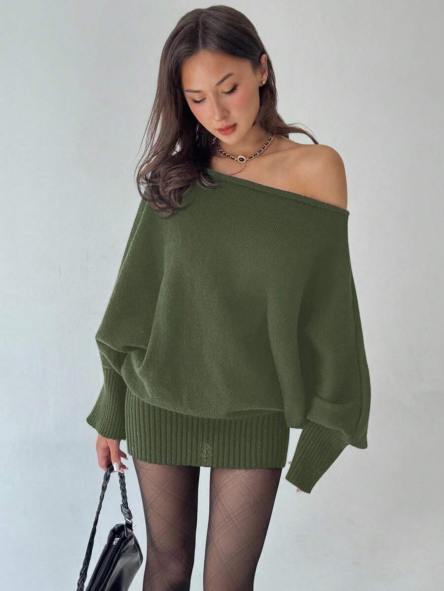 Embrace early 2000s style with this Y2K asymmetric shoulder bodycon sweater dress. The fitted silhouette hugs your curves while the off-shoulder design adds an edgy, modern twist. Perfect for layering through fall and winter, this cozy knit piece transitions effortlessly from casual days to night-out ready. The bodycon fit flatters your figure, while the asymmetrical neckline keeps things fresh and fashion-forward.