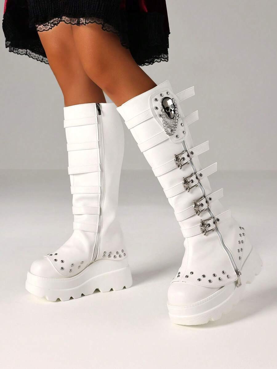 Step into bold style with these Y2K Goth Knee High Boots for Women. Featuring punk-inspired skull buckles, edgy chains, and towering platform wedge heels, they bring a rebellious twist to any outfit. Perfect for making a statement, these boots combine fierce attitude with standout comfort. Elevate your look and own the night with every step!