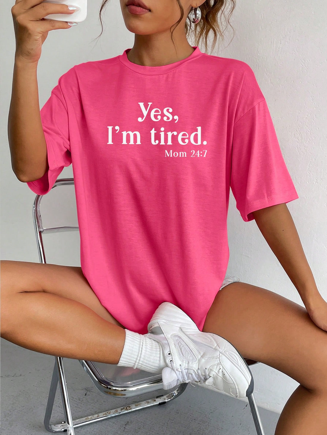 Take a break in style with the INAWLY Slogan Graphic Drop Shoulder Tee. This relaxed fit tee features a playful "Yes, I'm Tired Mom 24:7" slogan graphic, perfect for busy moms who deserve some comfort and humor in their wardrobe. Stay comfortable and stylish all day long!