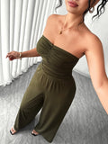 Close-up of olive-green strapless ruched bodice and wide-leg trousers