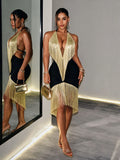Front and side view of black gold fringe halter cocktail dress with open back