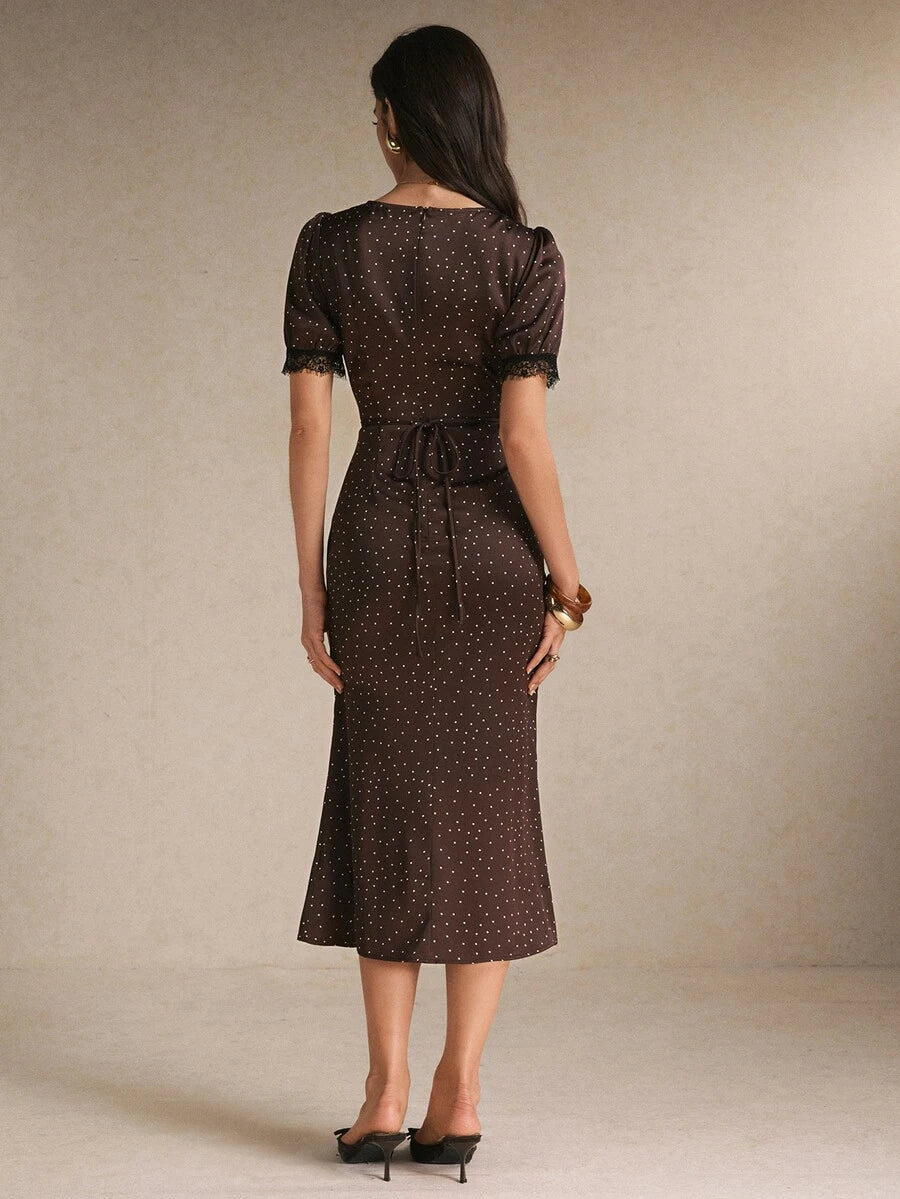 Back view brown polka-dot midi dress with waist tie and lace cuffs