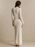 Rear view of the ivory knit cardigan and matching skirt showing the plain back and lace cuffs