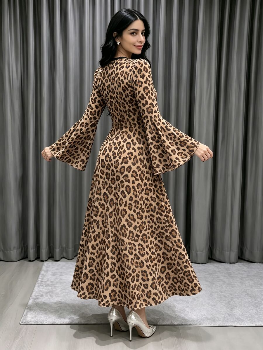 Front view of a tan leopard-print V-neck maxi dress with dark binding, fitted waist and flared long sleeves